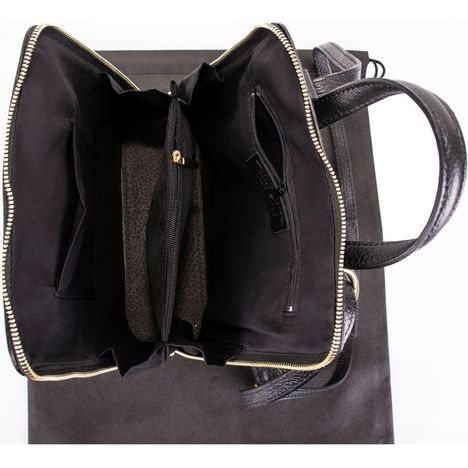primo sacchi romana black italian textured leather backpack shoulder crossbody and grab bag base showing the interior two main compartments separated by a zipped compartment and zipped lining compartment and large vanity pocket the other side