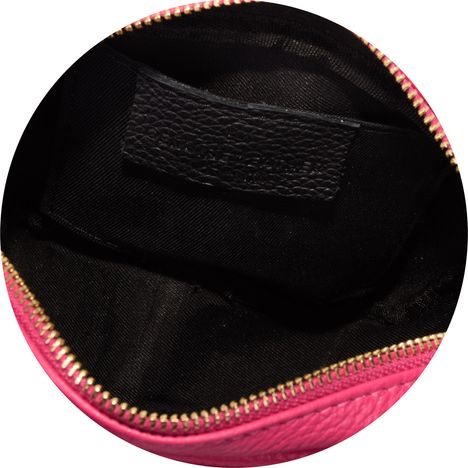 patch pocket inside the main compartment of a ladies fuchsia pink leather shoulder bag