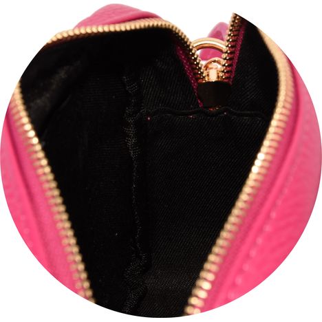 inside the main compartment of a ladies fuchsia pink leather shoulder bag