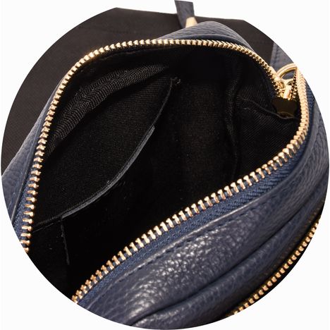 patch pocket inside the main compartment of a ladies navy blue leather shoulder bag