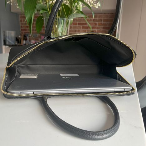 15" laptop inside a large womens black leather handbag with room to spare