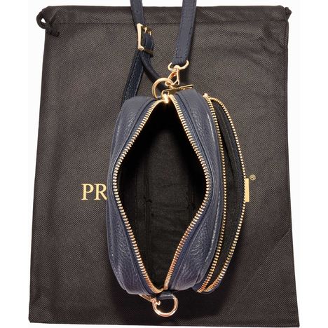above an open navy blue small italian leather shoulder crossbody bag
