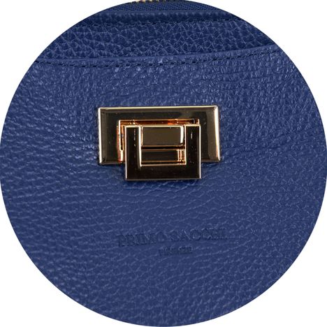 close up of the gold metal twist lock on a womens dark blue italian leather hand bag