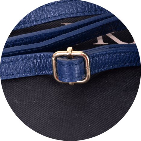 close up of ther gold metal sliding buckle on a shoulder crossbody blue leather strap 