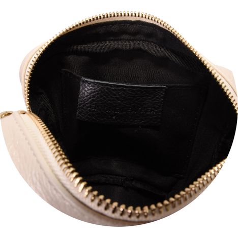 inside the main compartment of a ladies cream leather shoulder bag with patch pocket