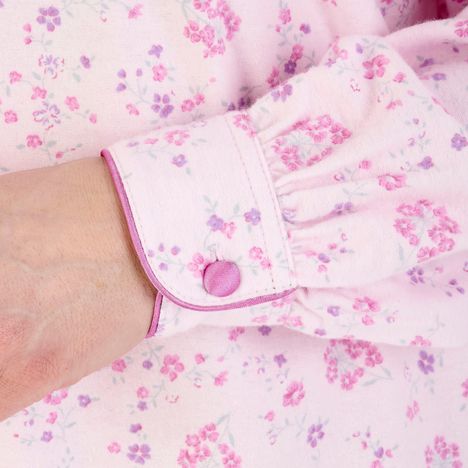 close up of cuff with satin trim & satin covered button on a womens pink brushed cotton nightdress