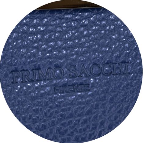 close up of embossed primo sacchi logo on a dark blue ladies italian leather handbag