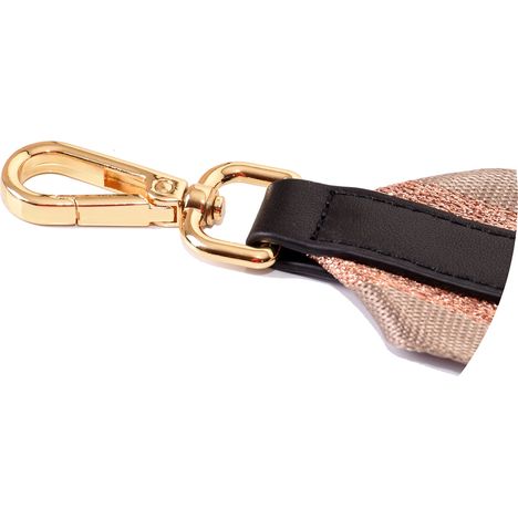chunky gold metal clip and black leather strap on a wide handbag shoulder strap