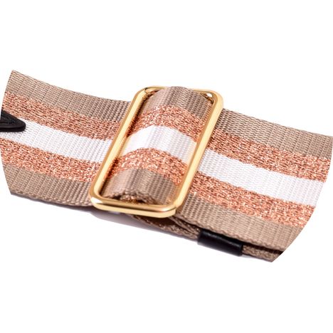 close up of gold metal sliding buckle on a wide rosegold beige and white adjustable handbag strap
