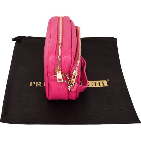 side and above view of a ladies small pink leather shoulder crossbody bag with gold zip