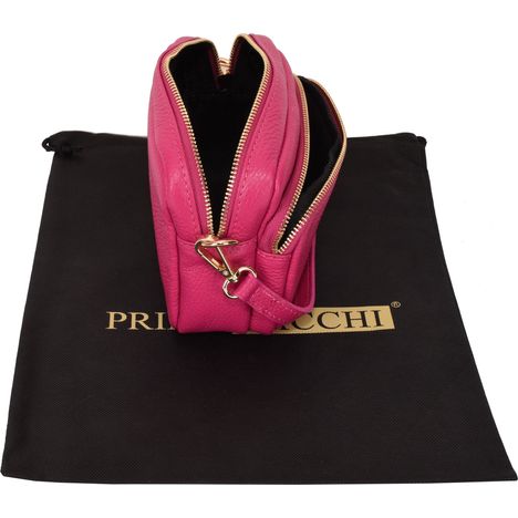 side and above view of an open small pink leather shoulder crossbody bag with black interior
