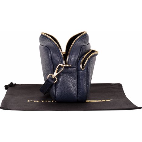 view of an open womens navy blue leather small shoulder crossbody bag from the side