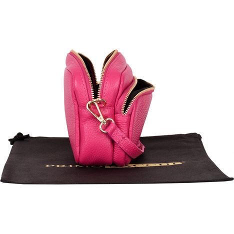 view of an open womens pink leather small shoulder crossbody bag from the side