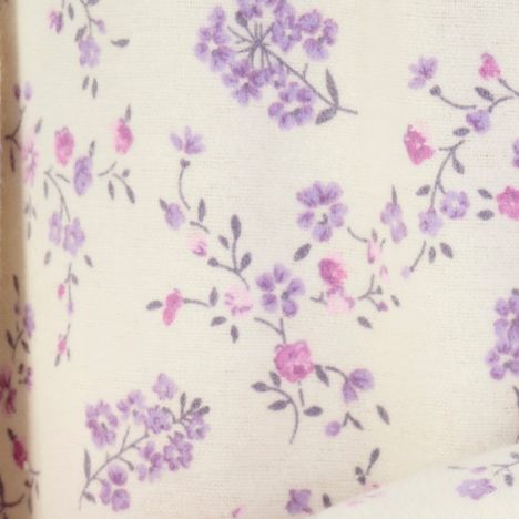 close up of the beautiful small flower pattern on a womens cream winter brushed cotton nightdress