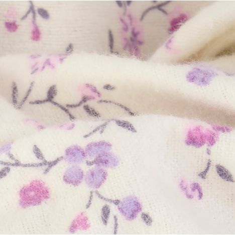 close up of the soft fluffy brushed cotton on a womens cream winter nightdress