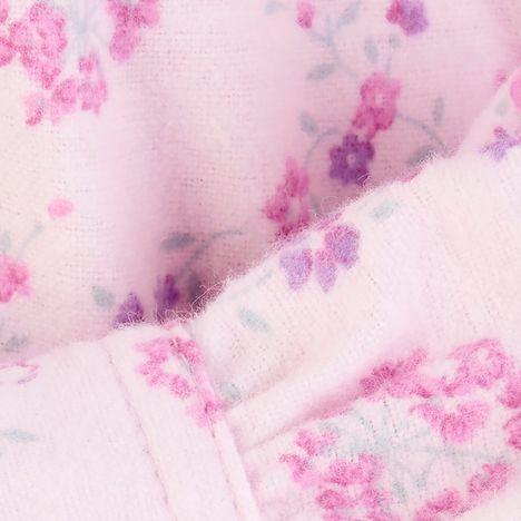 close up of the soft fluffy brushed cotton on a womens pale pink floral winter nightdress