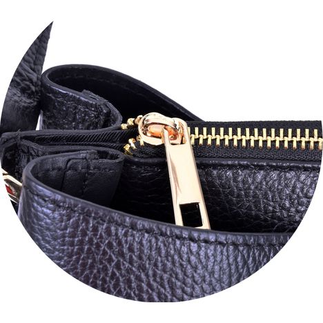 close up of a chunky gold metal zip puller on a ladies large black leather tote bag