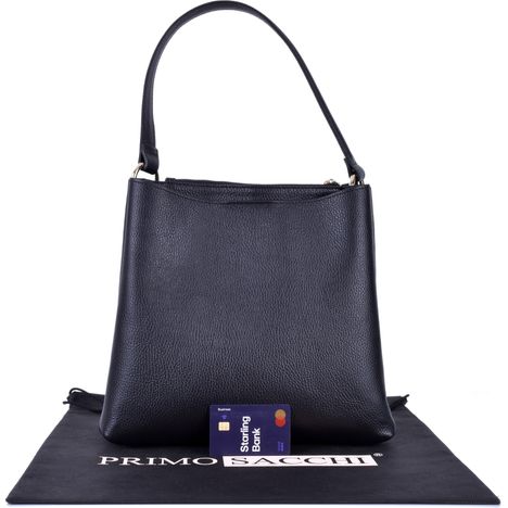 rear view of a ladies large black leather tote bag with a credit card for size guidance