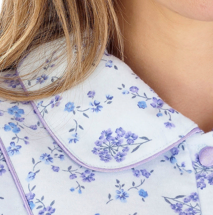 close up of blue rounded collar with satin trim on an elderly ladies luxury soft cotton nightdress 