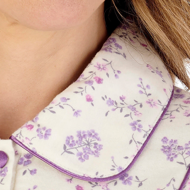 close up of a rounded collar with satin trim on an elderly ladies luxury blue winter nightdress