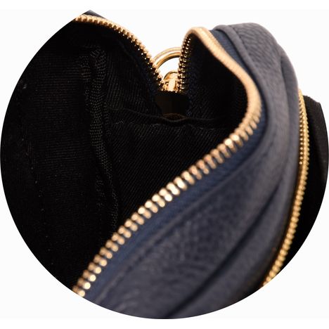 inside the main compartment of a ladies navy blue leather shoulder bag