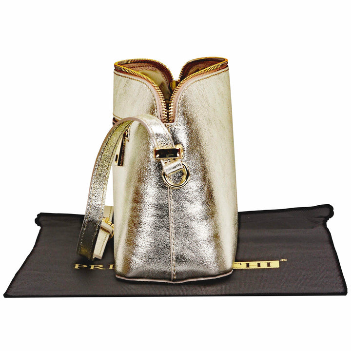 side view of open womens gold italian leather shoulder and cross body bag