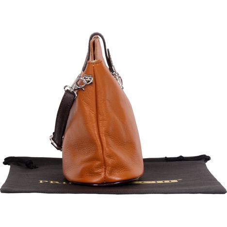 side view of closed small womens soft tan and dark brown italian leather shoulder and crossbody bag