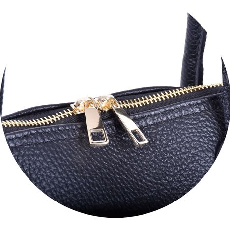close up of double gold metal zip pullers on a womens black italian leather grab bagllllllllllllllll