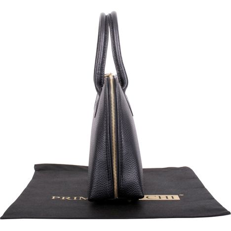 side view showing slim profile and gold meatl zip on a black grab bag in italian textured leather