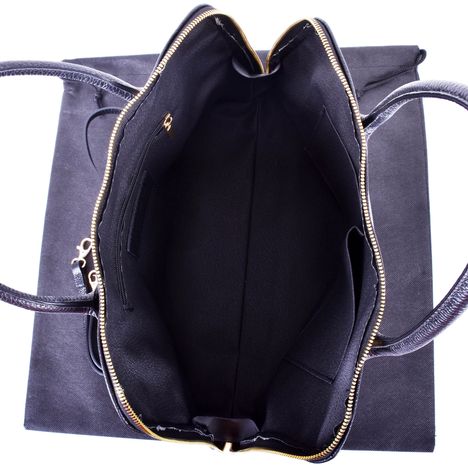 view of the large single compartment of a womens large ital leather grab bag with gold zip