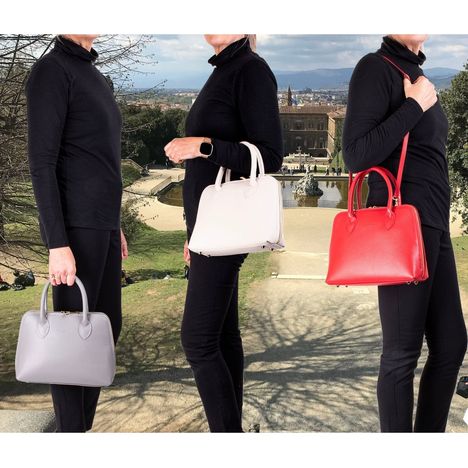 primo sacchi gisella grab bag being modelled on shoulder crook of arm and being held by handles